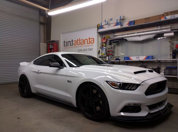 White Ford Mustang GT 5.0 with ceramic window tint installation at TintButler Gainesville