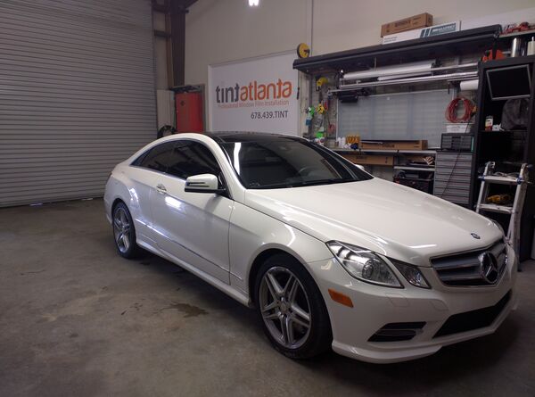 White Mercedes-Benz E-Class Coupe with professional window tinting Gainesville
